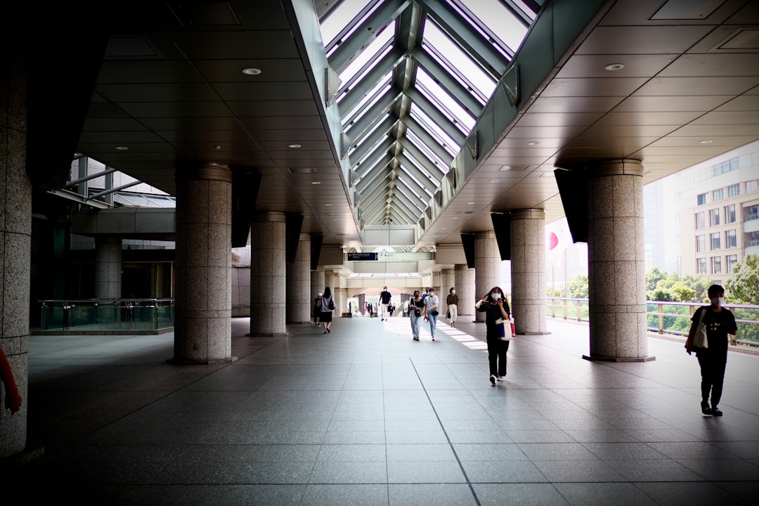 people walking on white tiled floor