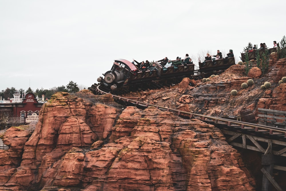 black and gray truck on brown rock formation during daytime