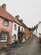 A charming street in a Portuguese village with colorful houses.