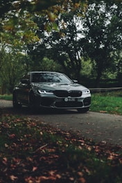 black bmw m 3 parked on road during daytime