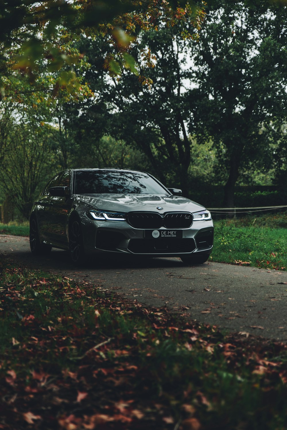 black bmw m 3 parked on road during daytime