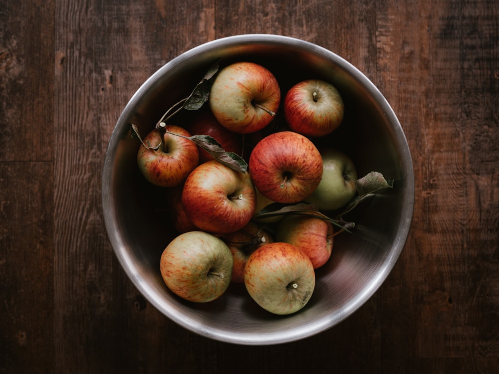 red apples on stainless steel bowl
