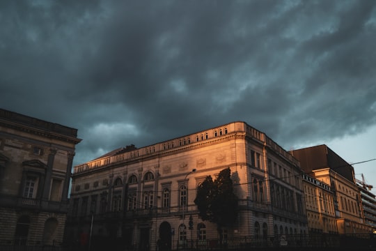 brown concrete building under cloudy sky during daytime in Ghent Belgium