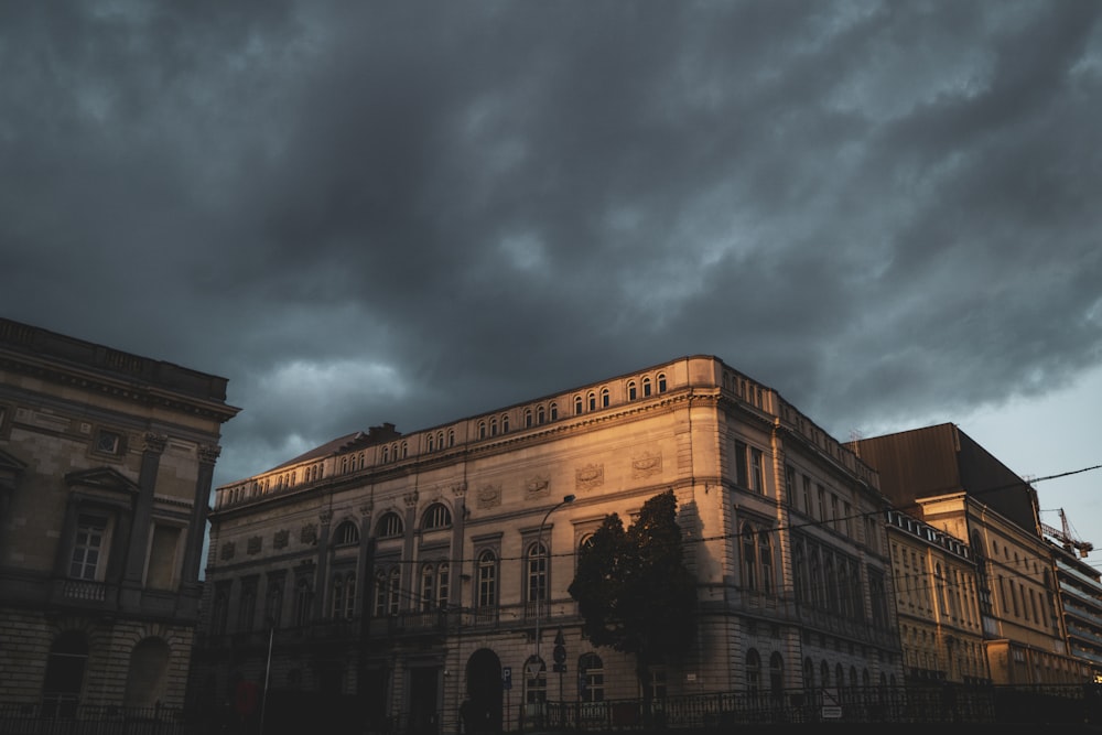 brown concrete building under cloudy sky during daytime