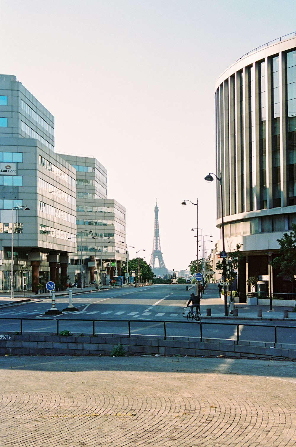 people walking on sidewalk near high rise buildings during daytime