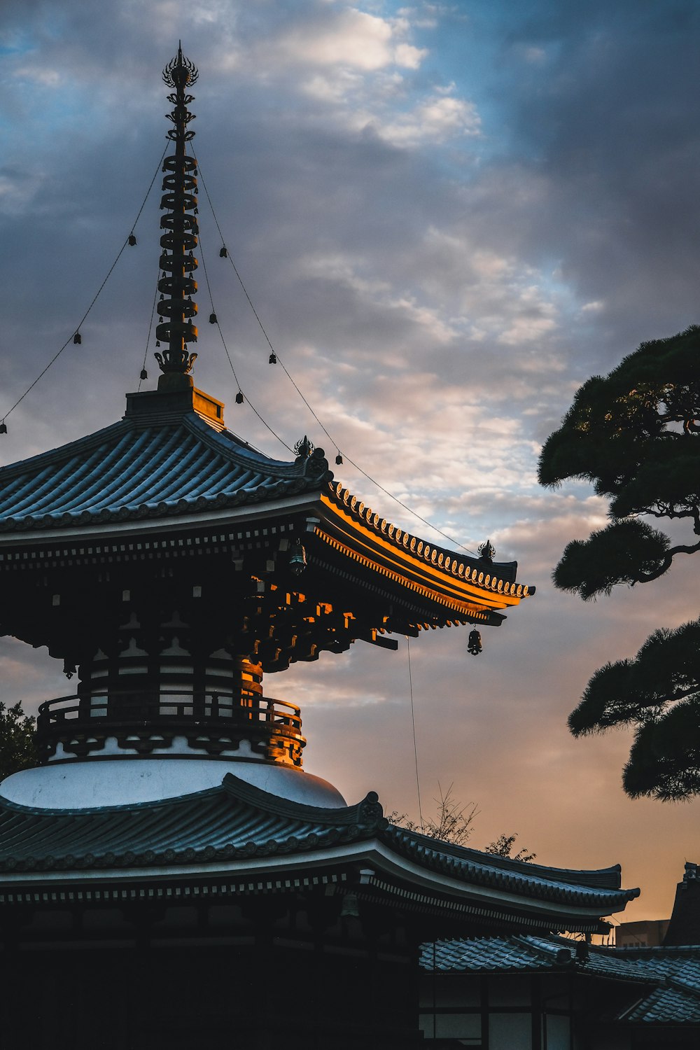 brown and white temple under cloudy sky