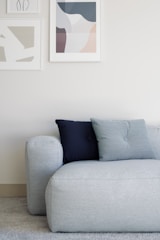 white throw pillow on white couch