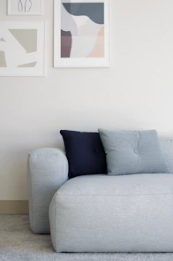 white throw pillow on white couch