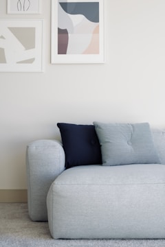 white throw pillow on white couch