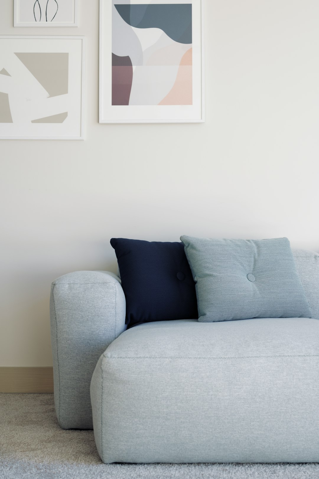  white throw pillow on white couch sofa