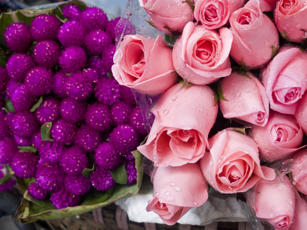 pink roses bouquet on green plastic basket