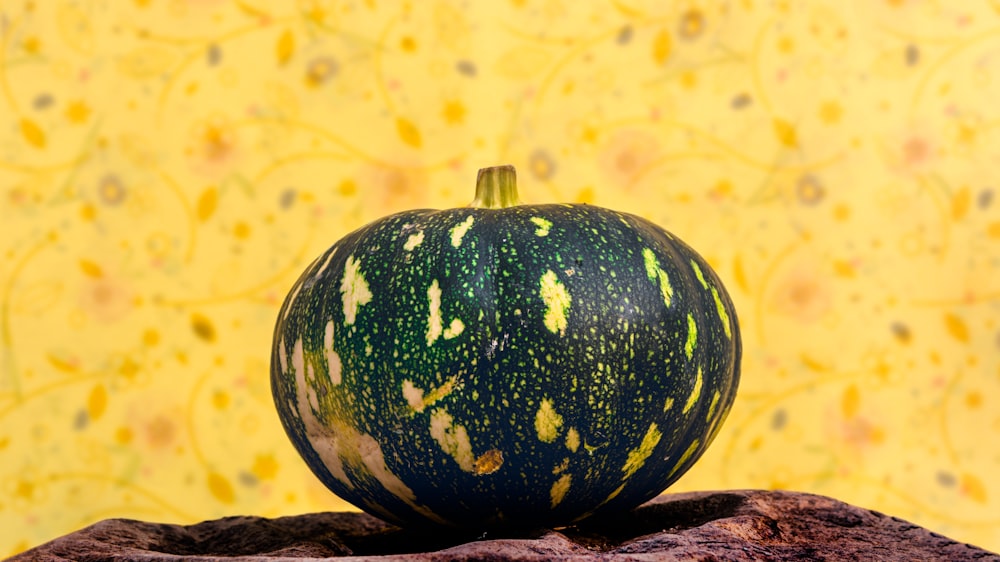 green and yellow fruit on brown wooden surface