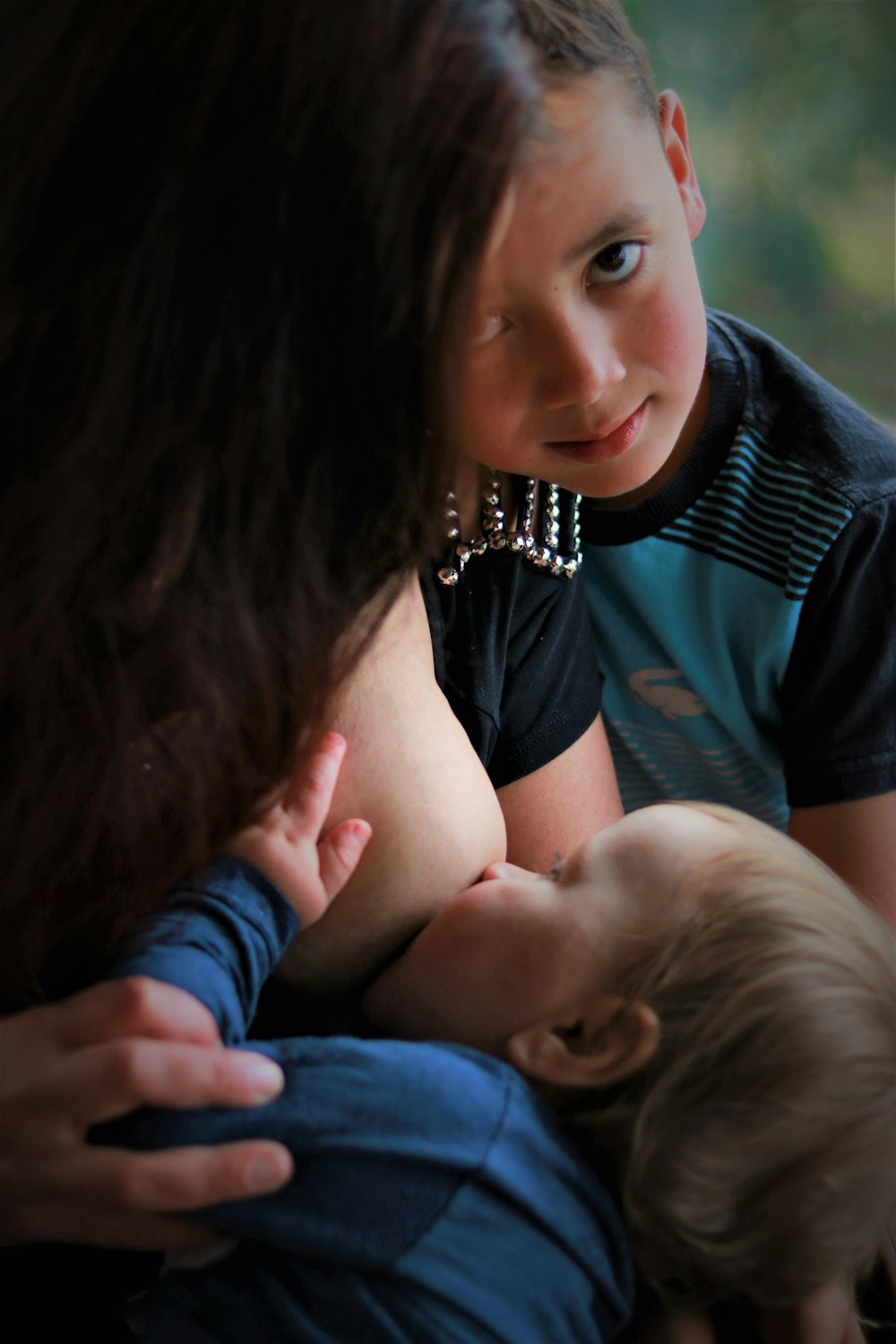 woman in black shirt lying on mans lap