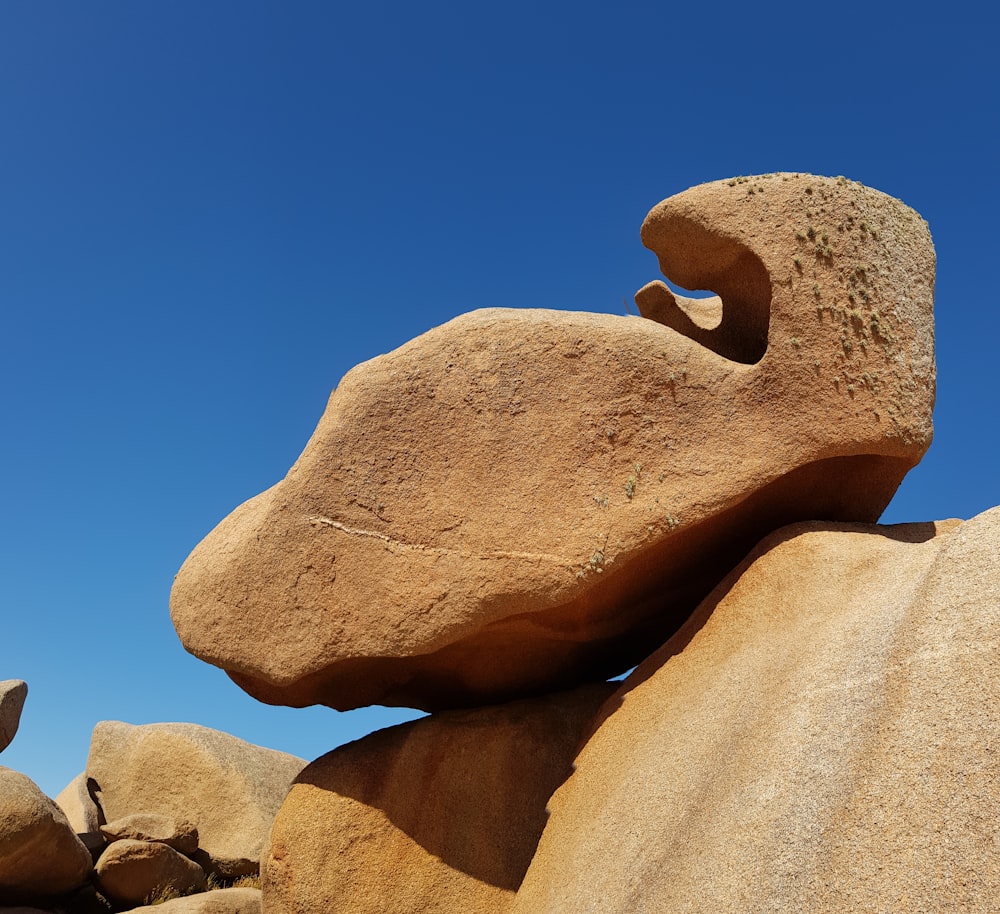 brown rock formation under blue sky during daytime