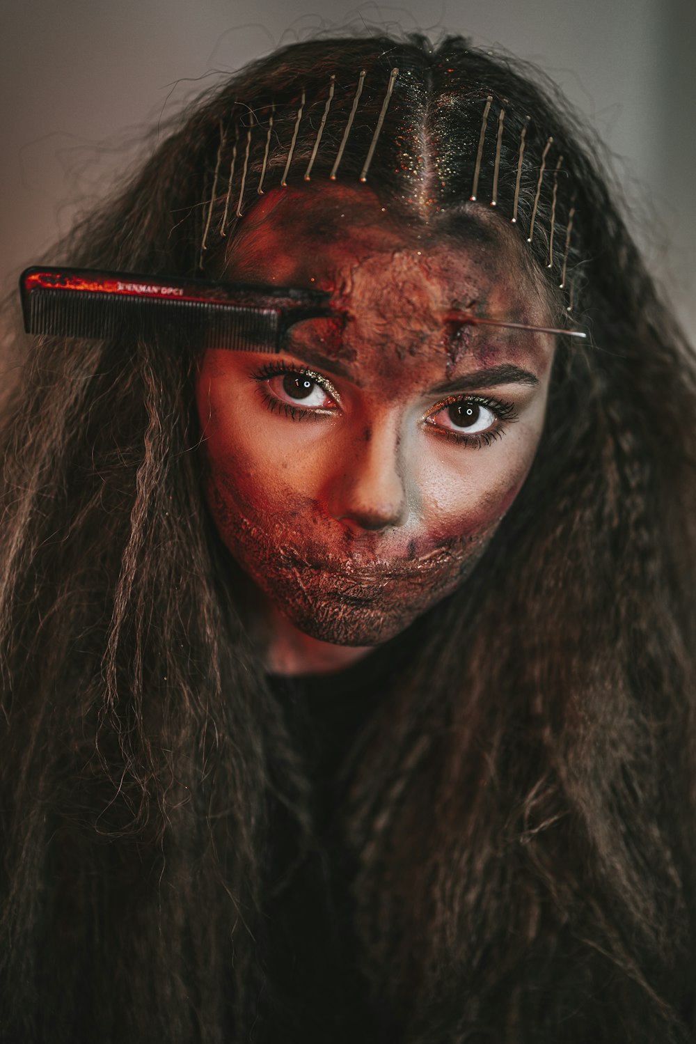 woman with red and black face paint