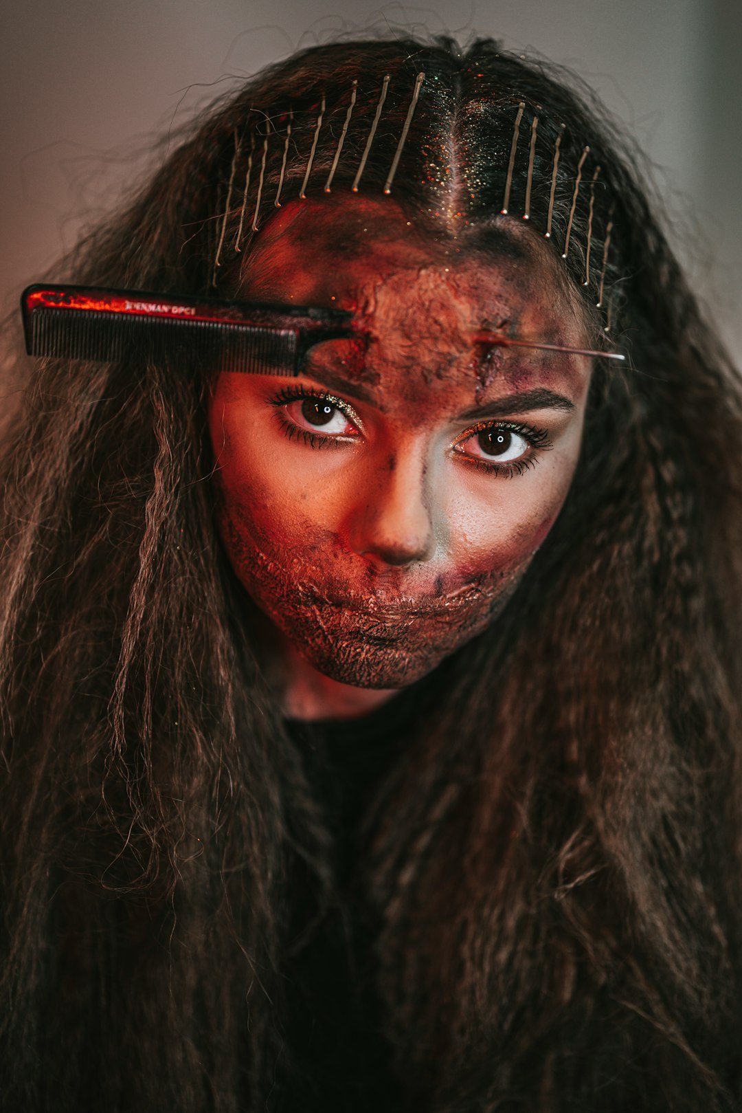 woman with red and black face paint