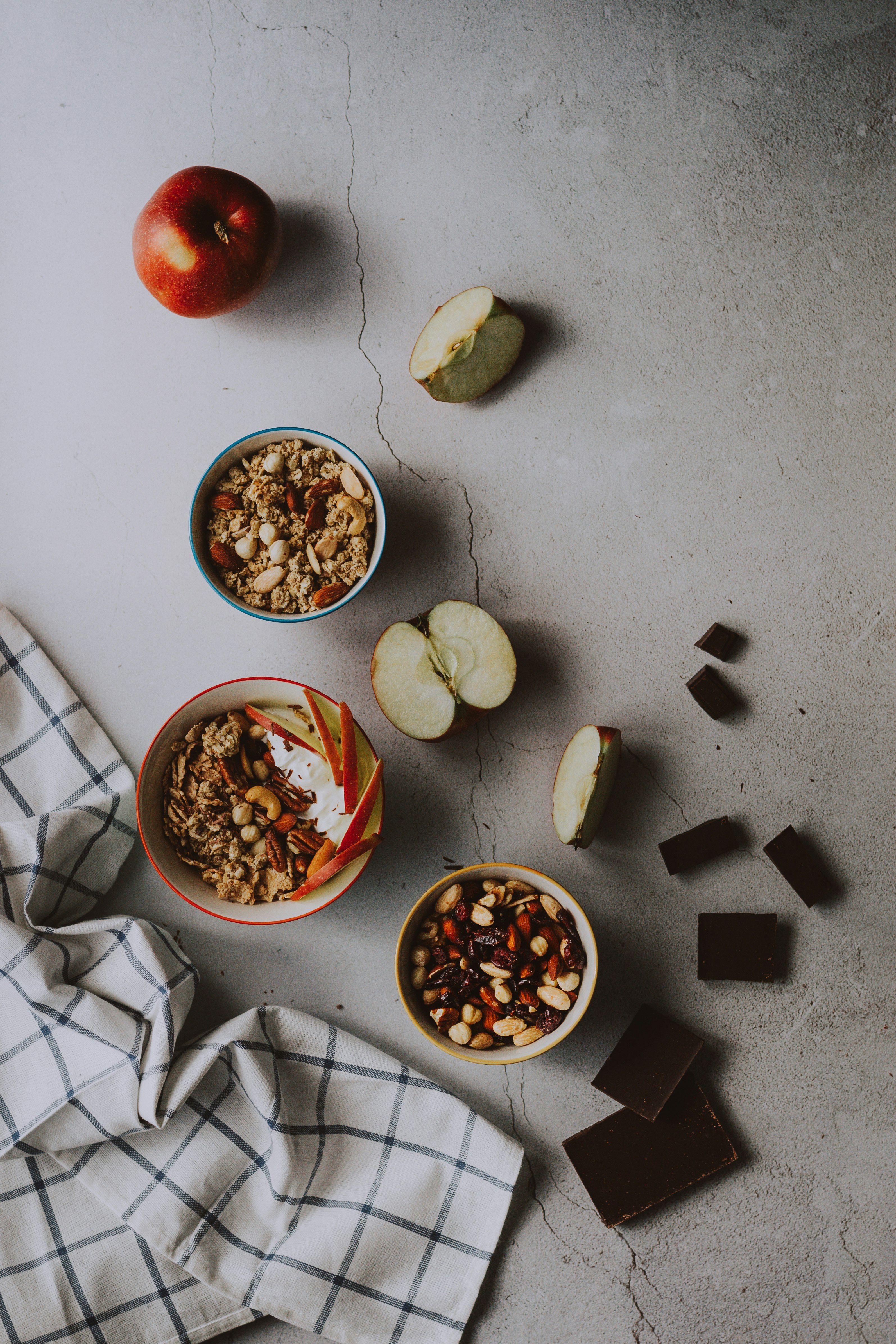 red apple fruit beside white ceramic bowl with brown liquid