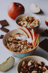 sliced strawberries and nuts in blue ceramic bowl