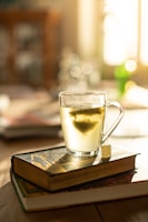 clear glass mug on brown wooden table