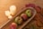 Colorful seasonal trays displayed on a rustic wooden table.