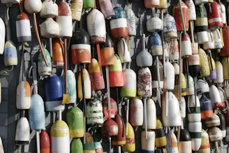 A selection of colorful fishing floats neatly arranged on a rustic table.
