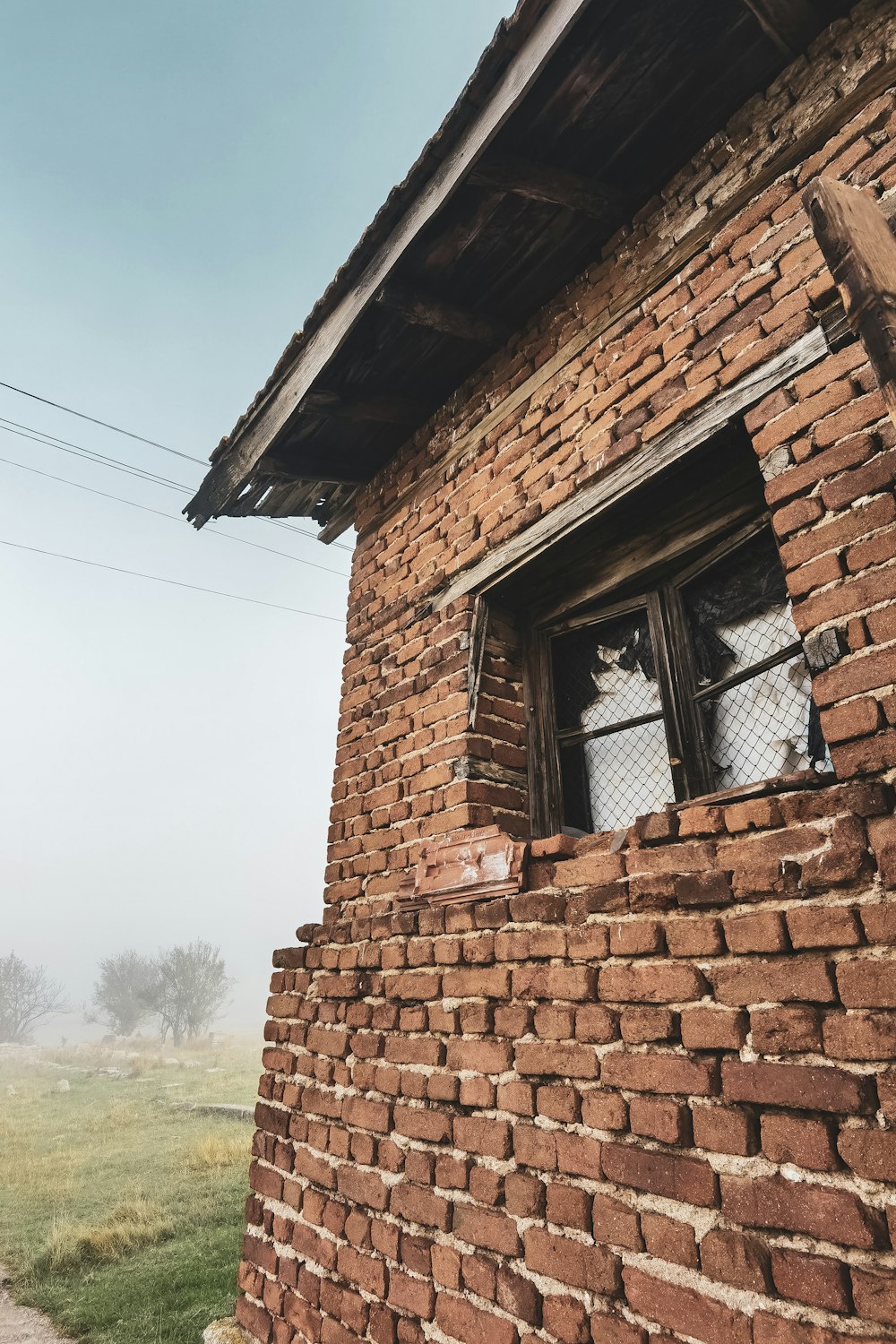 brown brick house with glass window