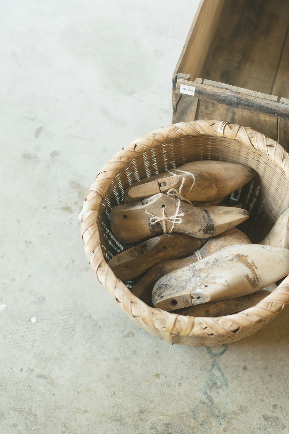 brown wooden shoes in brown woven basket