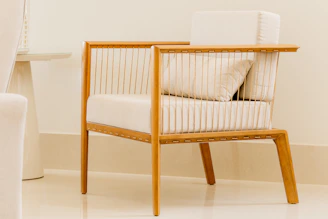 white and brown wooden armchair