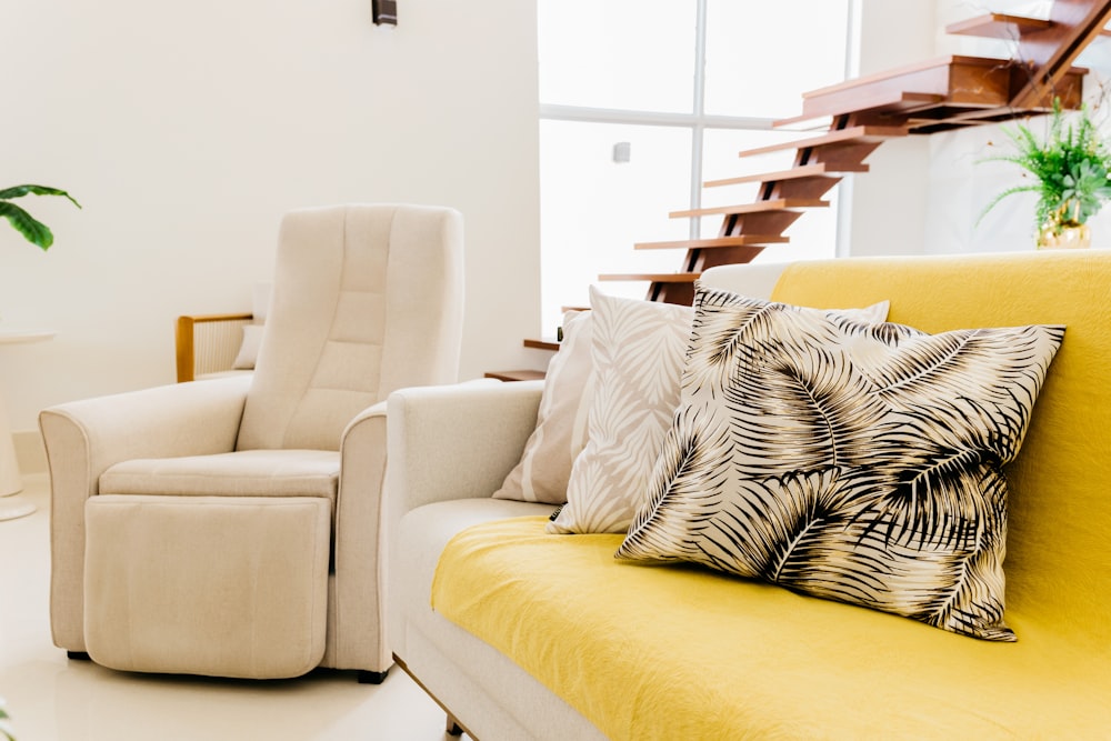 white and black zebra print throw pillow on white couch