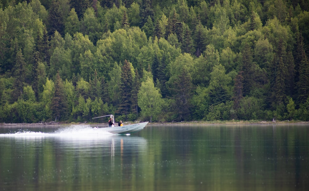white boat on lake during daytime