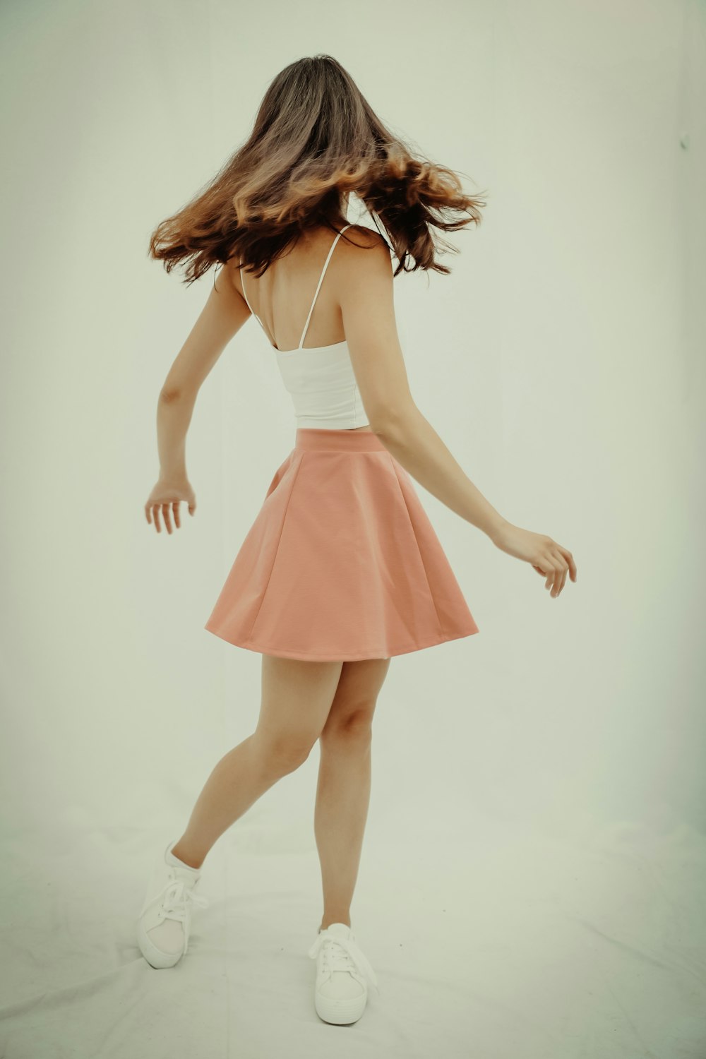 woman in white and pink tube dress