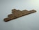 Wooden Scrabble tiles arranged to form the words 'I AM STILL LEARNING' on a flat surface.