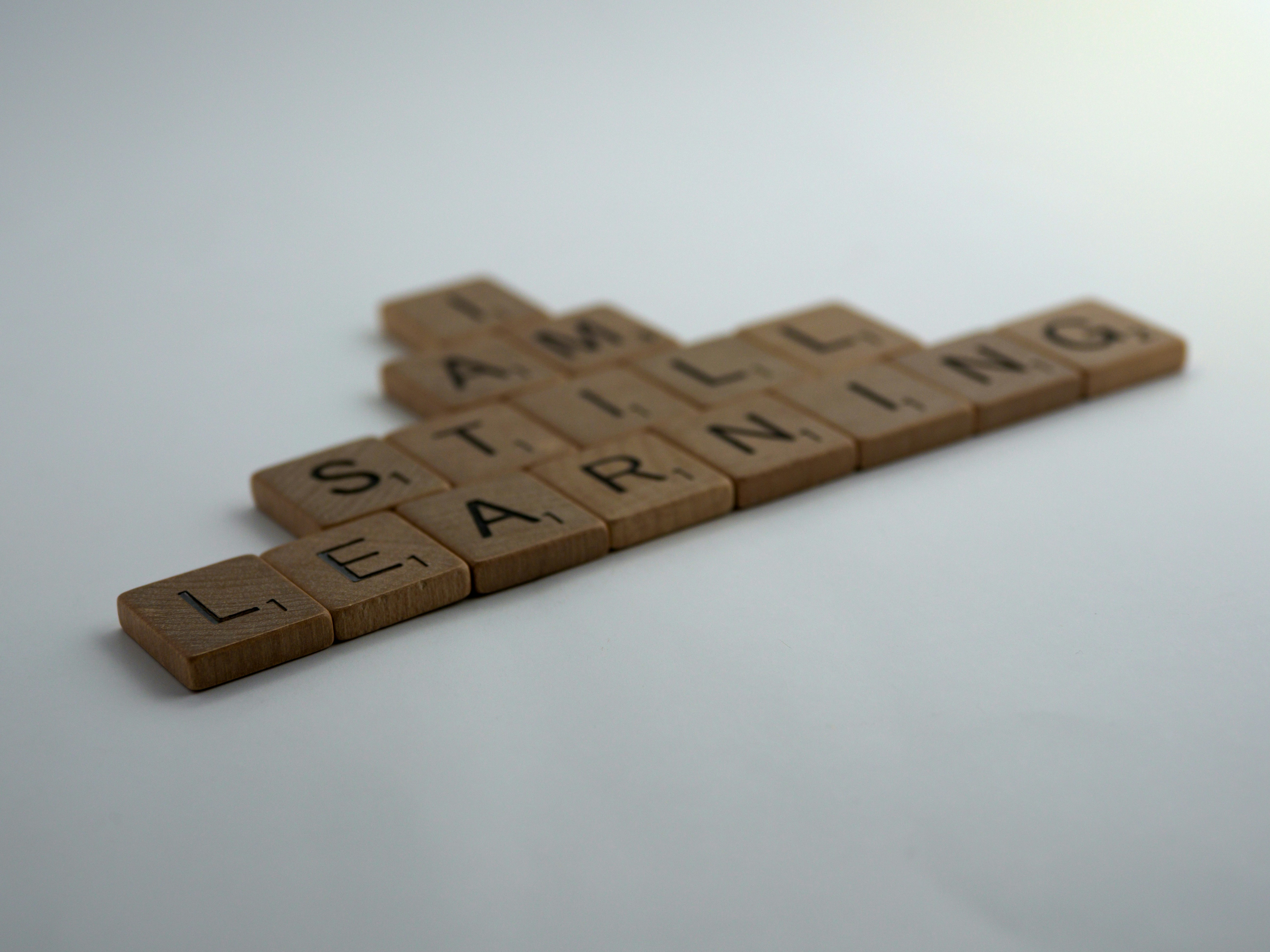 scrabble, scrabble pieces, lettering, letters, wood, scrabble tiles, words, quote,i am still learning, learning, learn, study, life study, always learning, world student, student of life, <br/>