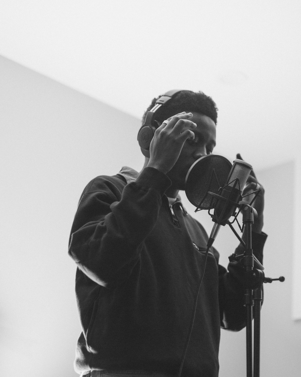 man in black jacket wearing headphones