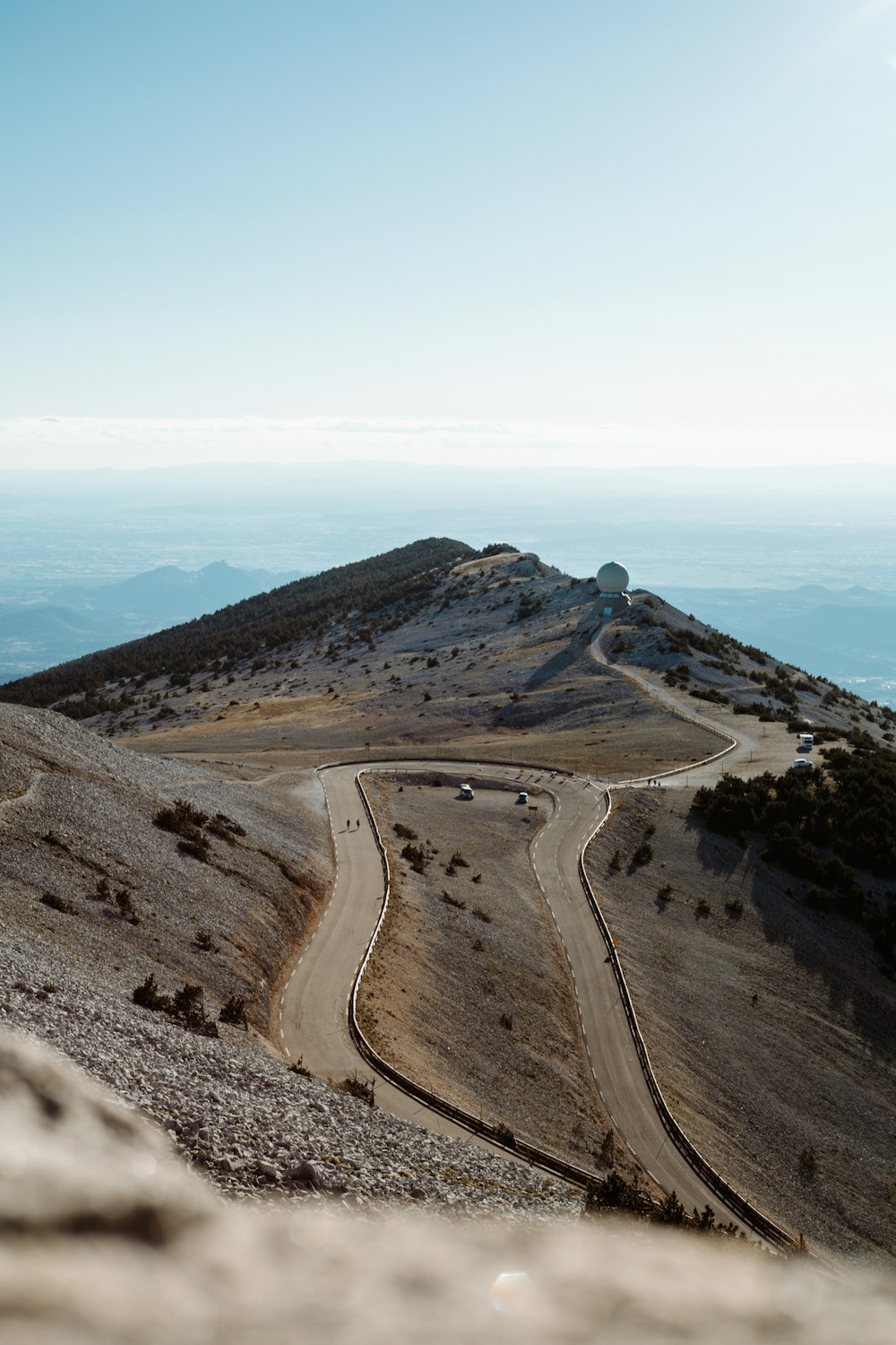 aerial view of a road in the middle of a mountains