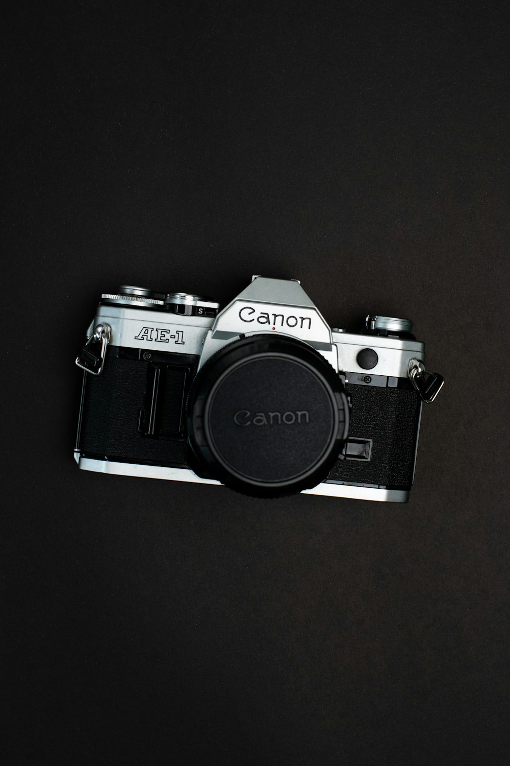 black and silver canon dslr camera