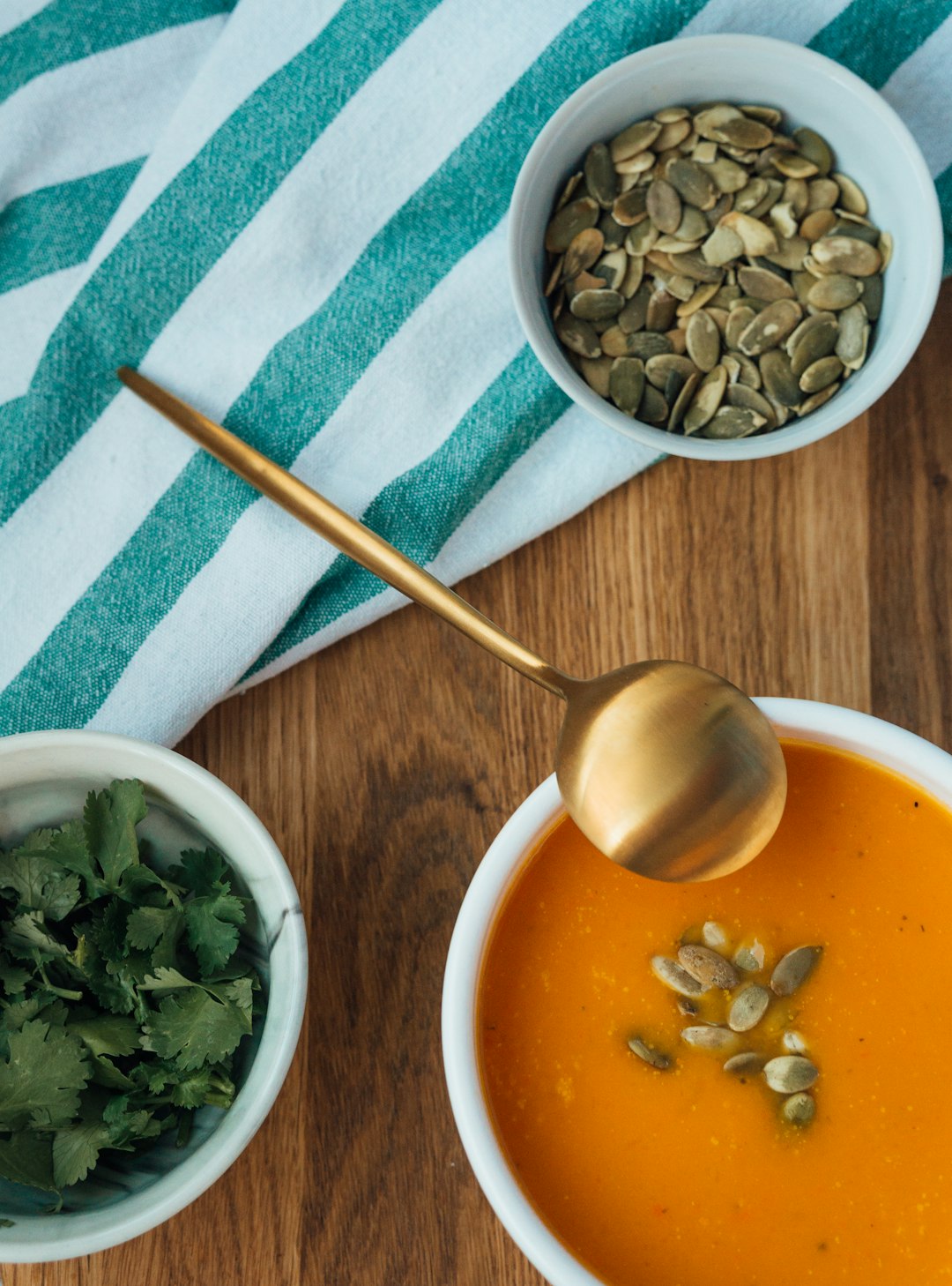 white ceramic bowl with stainless steel spoon