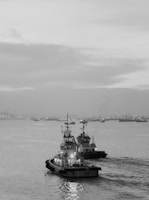 grayscale photo of ship on sea