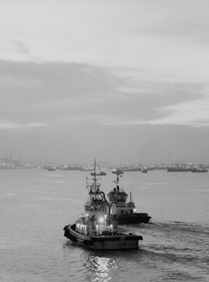 grayscale photo of ship on sea