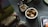 A close-up of a beautifully arranged display of various items on a wooden table.