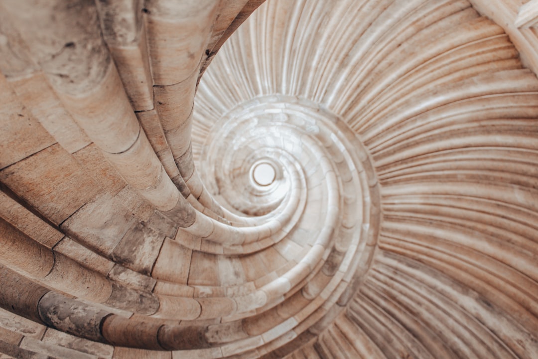 brown and white spiral staircase,