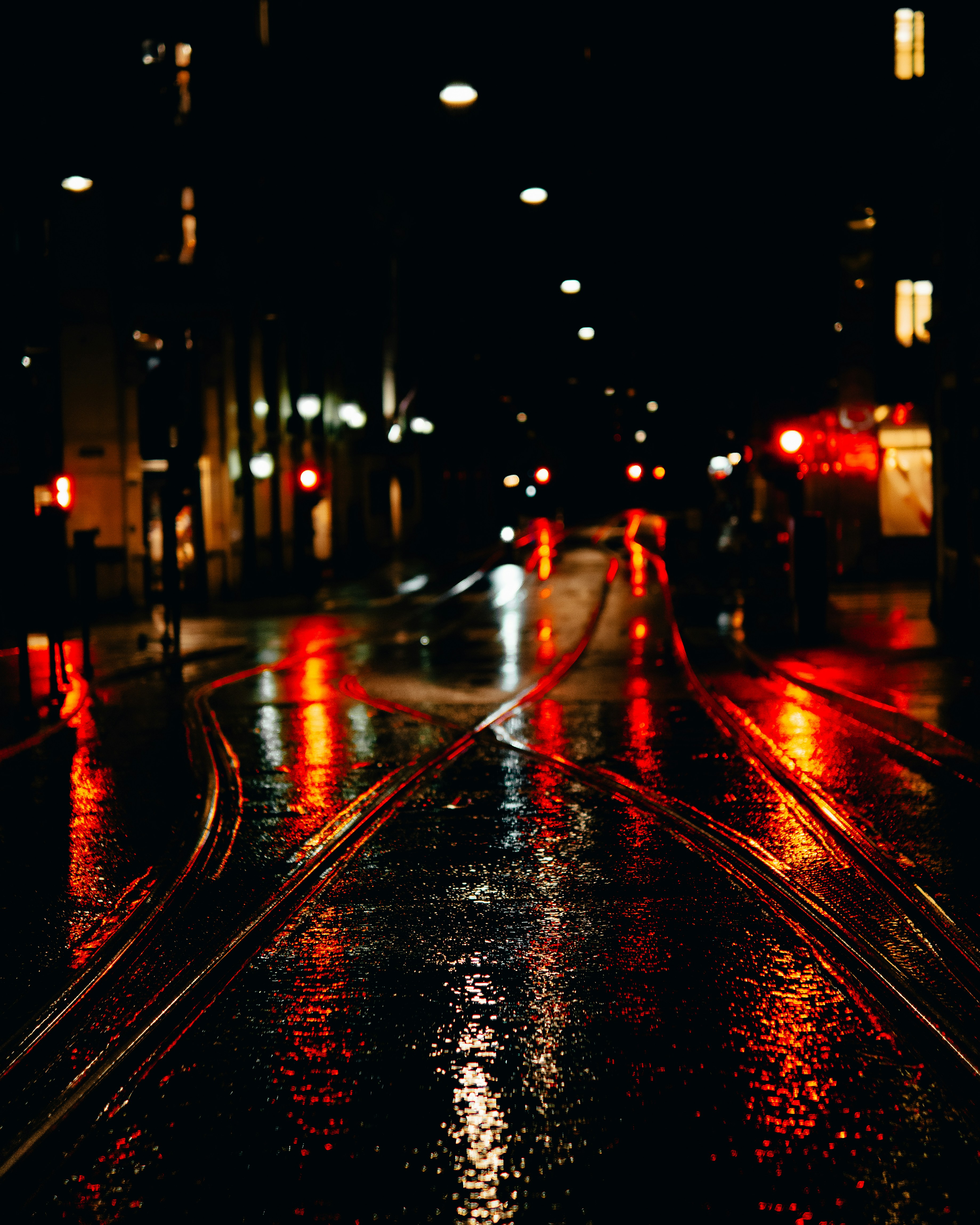 city street with cars during night time