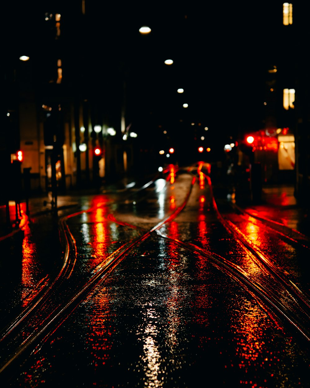 city street with cars during night time