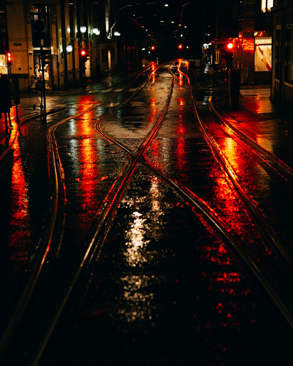 city street with red lights during night time