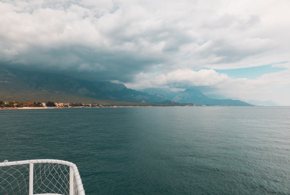 body of water under cloudy sky during daytime