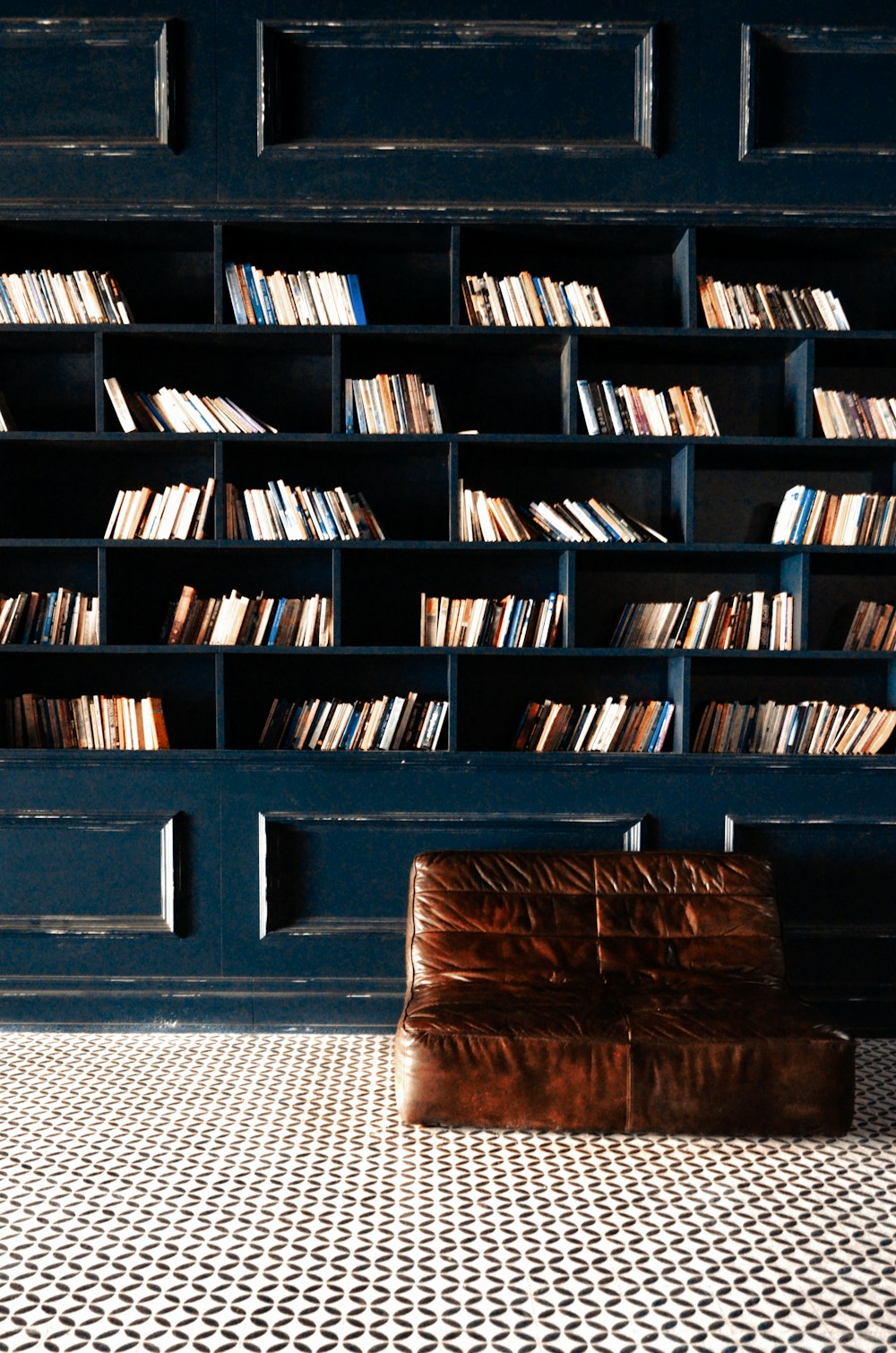 brown wooden book shelf with books