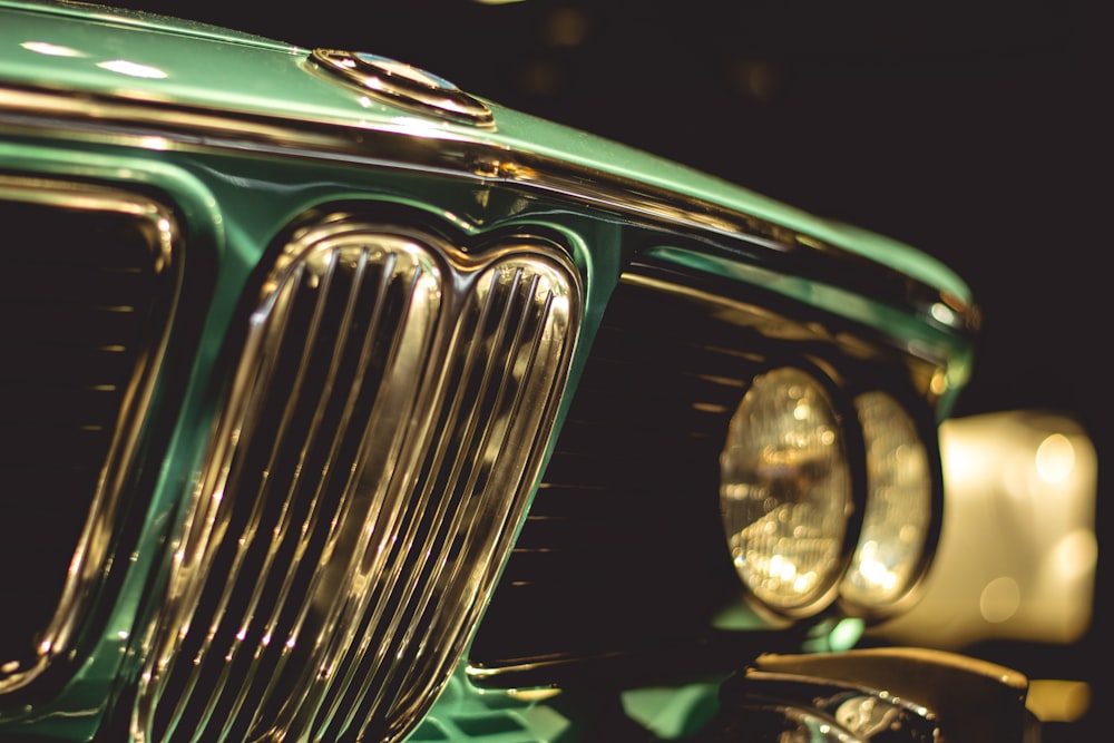 green and silver car with light