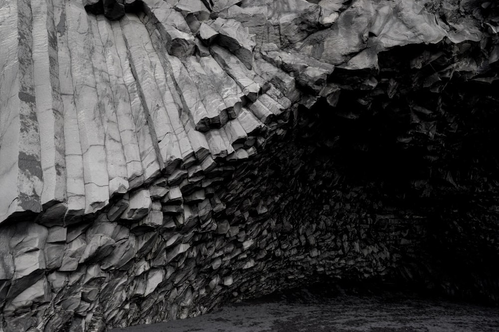 a black and white photo of a rock formation