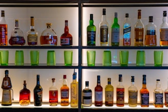 assorted glass bottles on shelf