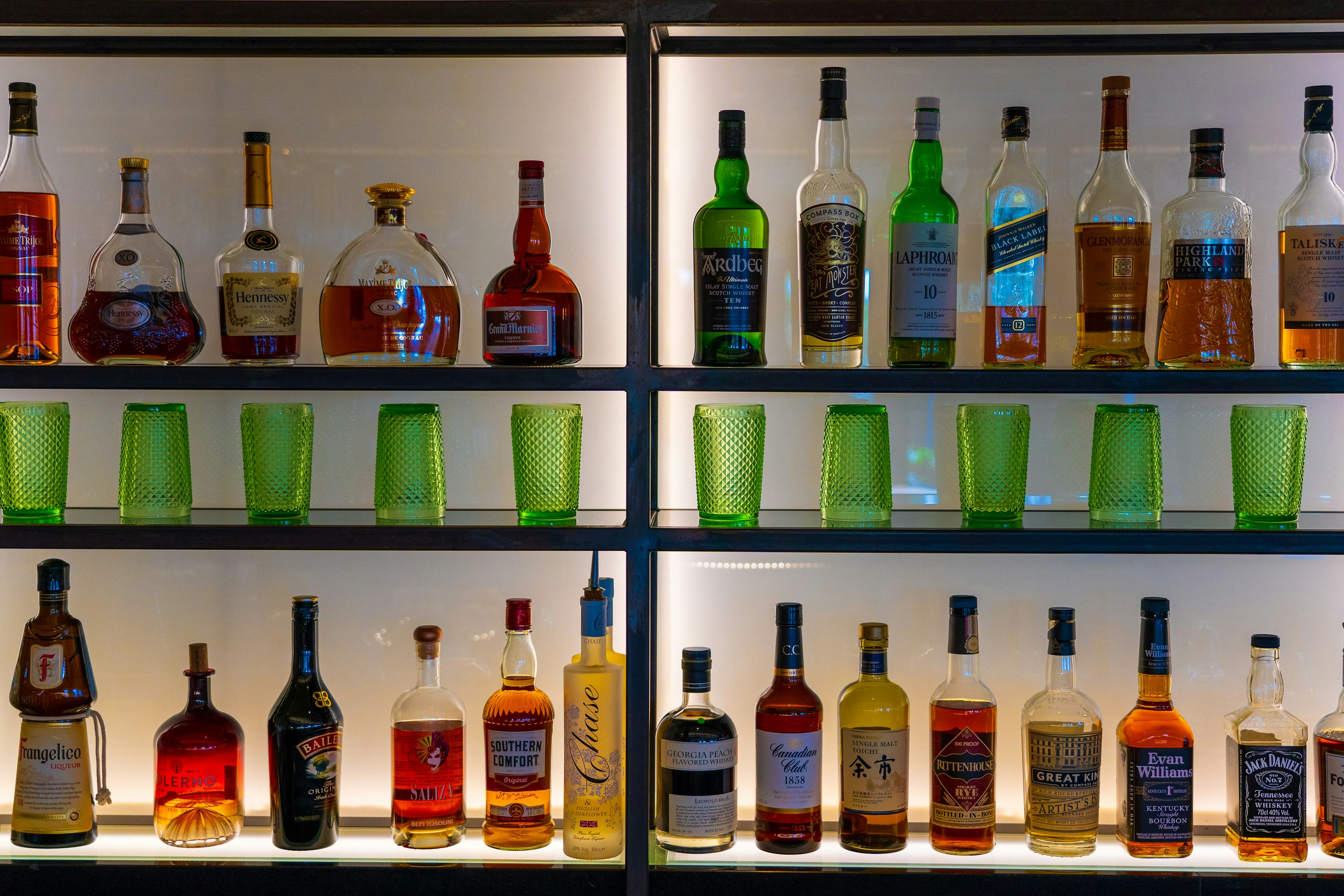 assorted glass bottles on shelf